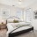 Charming bedroom featuring a fresh white and green bed with plush pillows, and expansive window blinds 
